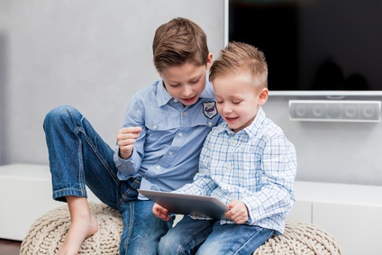 Two boys using tablet pc
